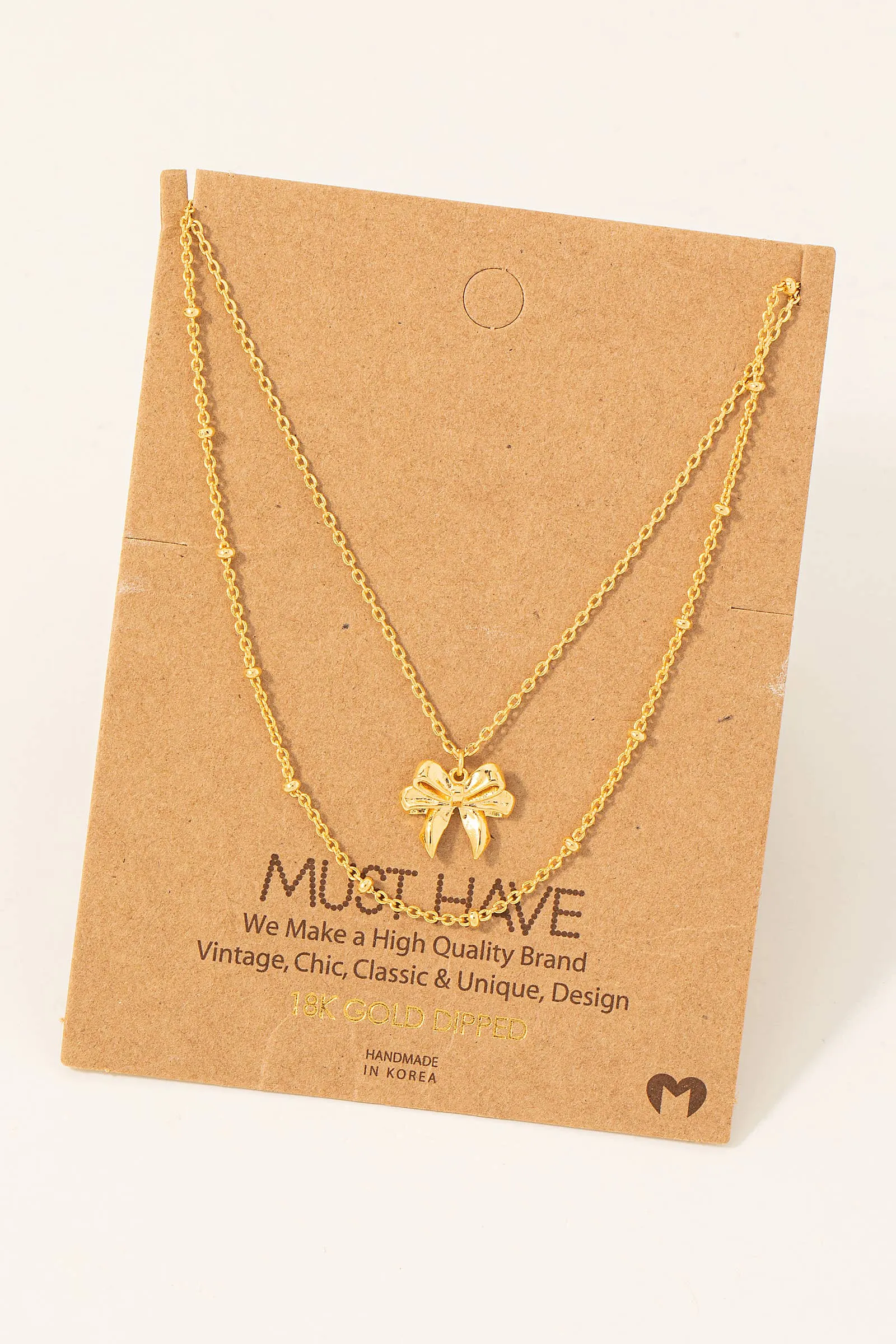 Gold Dipped Knotted Ribbon Bow Pendant Necklace