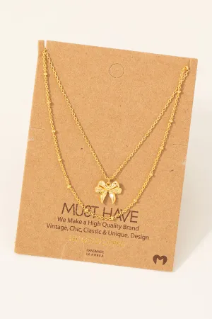 Gold Dipped Knotted Ribbon Bow Pendant Necklace