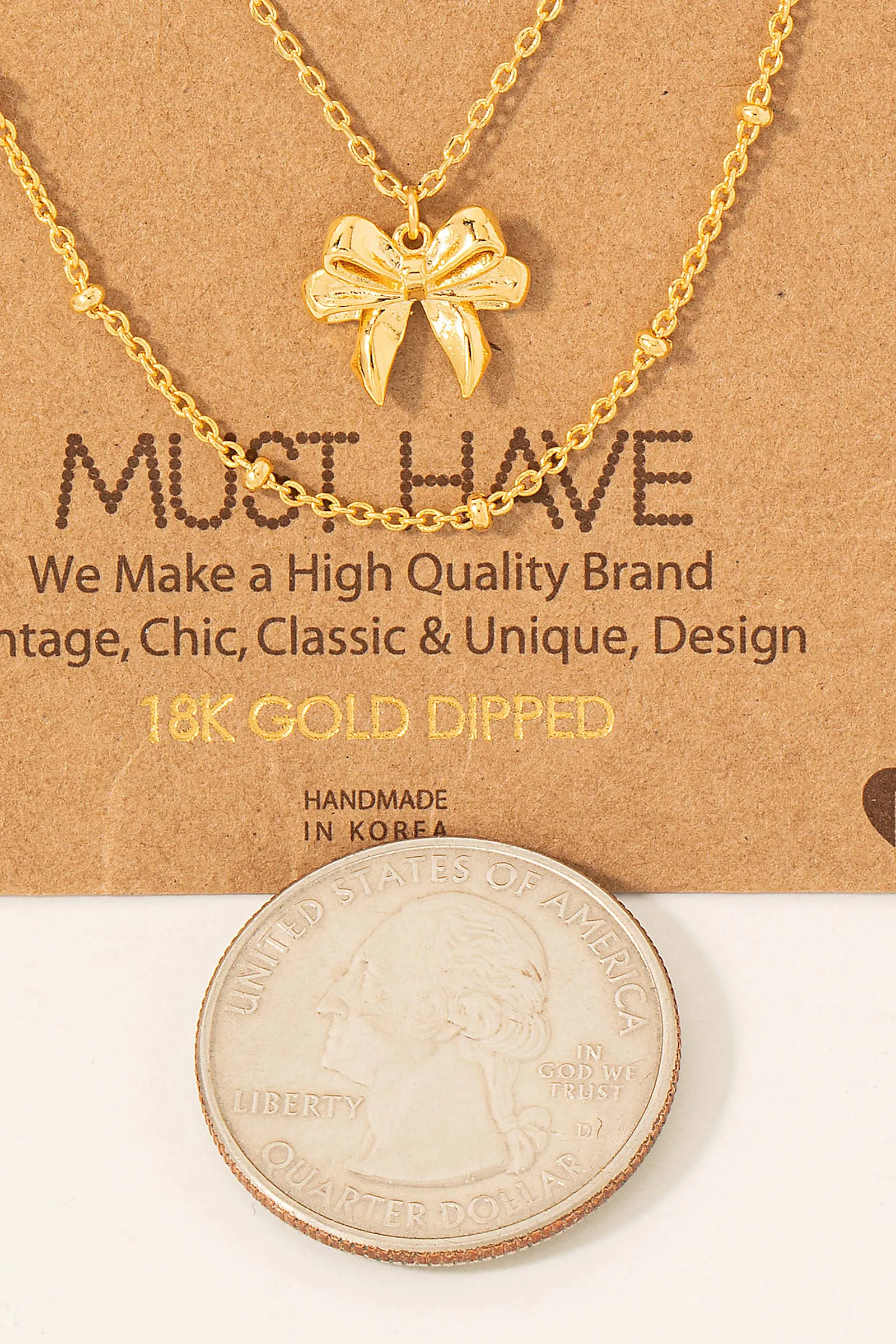 Gold Dipped Knotted Ribbon Bow Pendant Necklace
