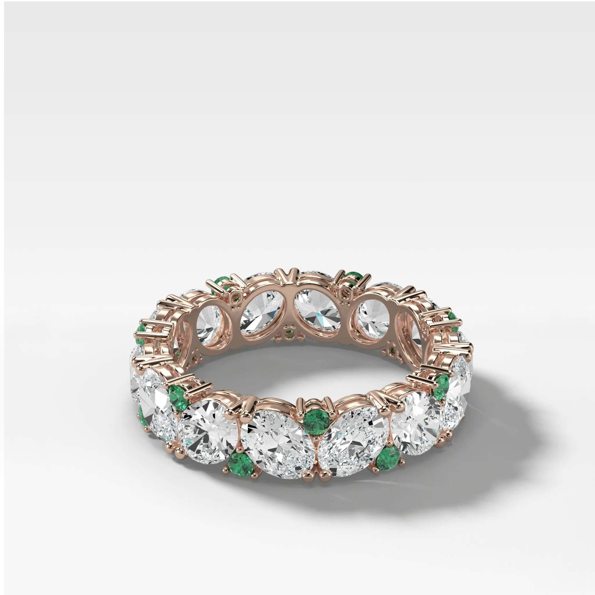 Oval Diamond and Green Emerald Medley Eternity Band