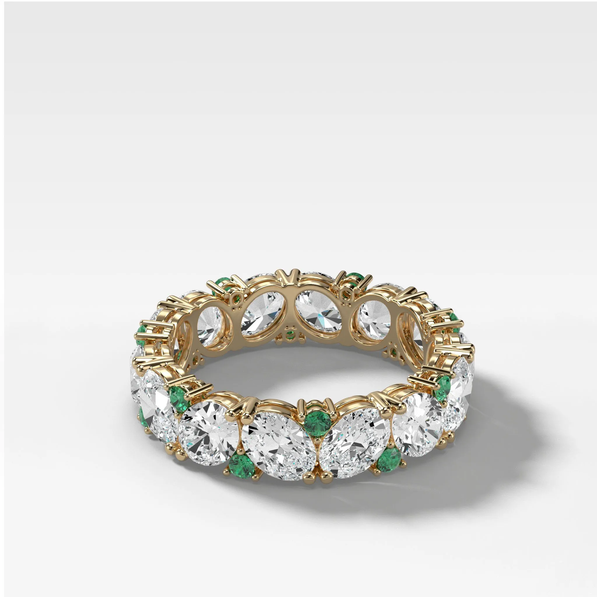 Oval Diamond and Green Emerald Medley Eternity Band