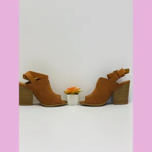 Rust suede shoe with a wood heel