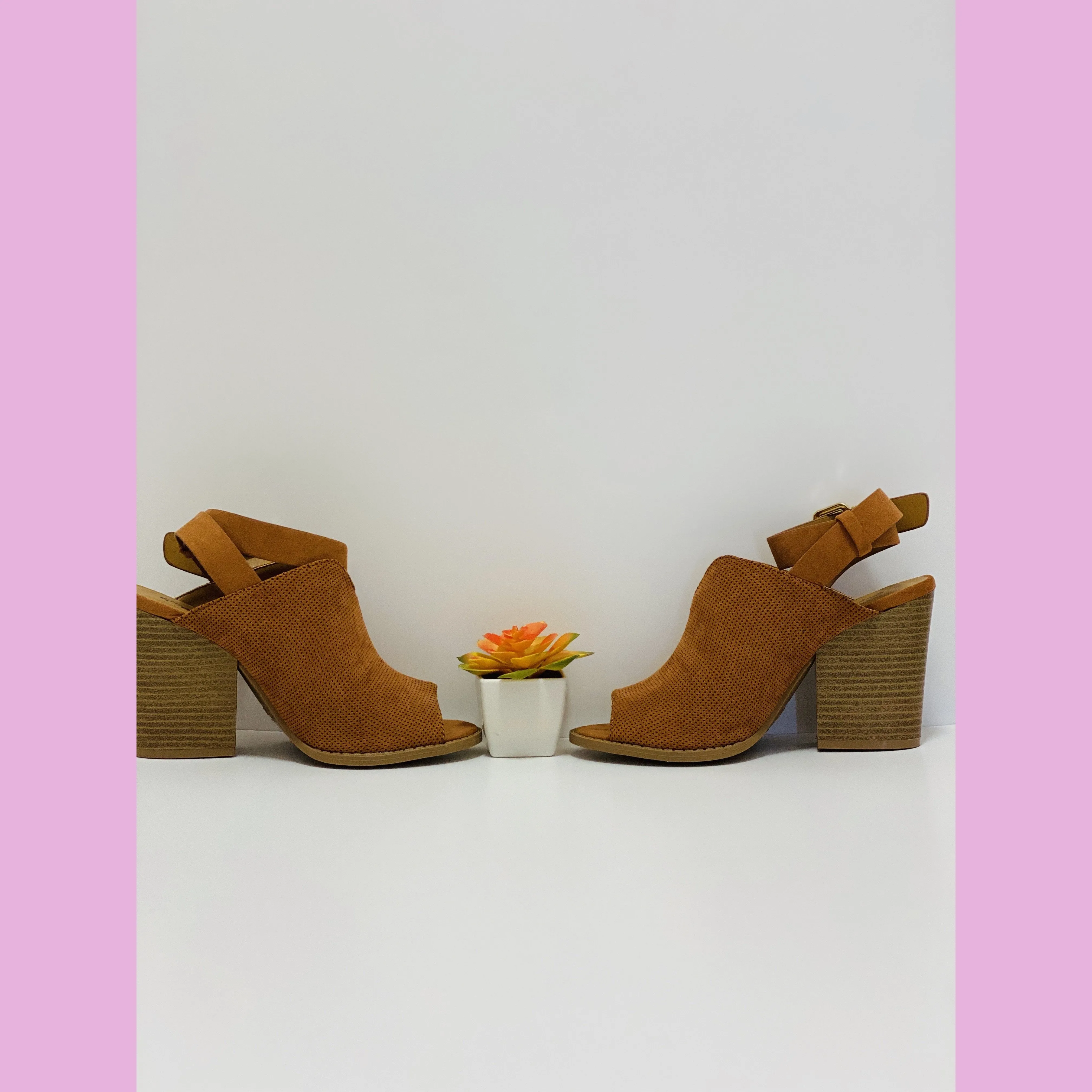 Rust suede shoe with a wood heel